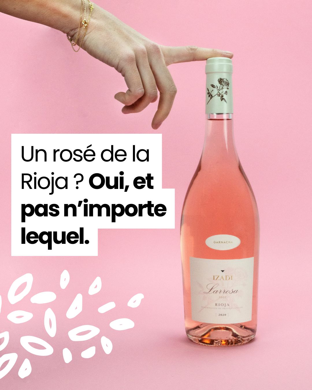 Bouteille de Larrosa Izadi avec texte promotionnel sur fond rose.
