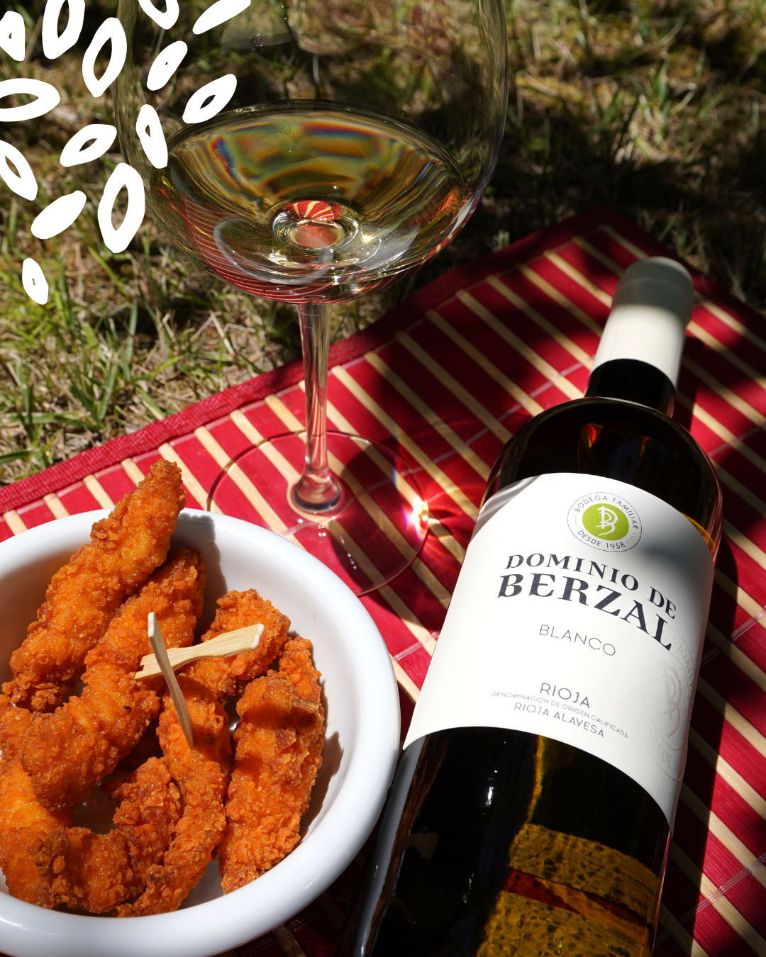 Verre de vin blanc Dominio de Berzal avec rabas croustillantes